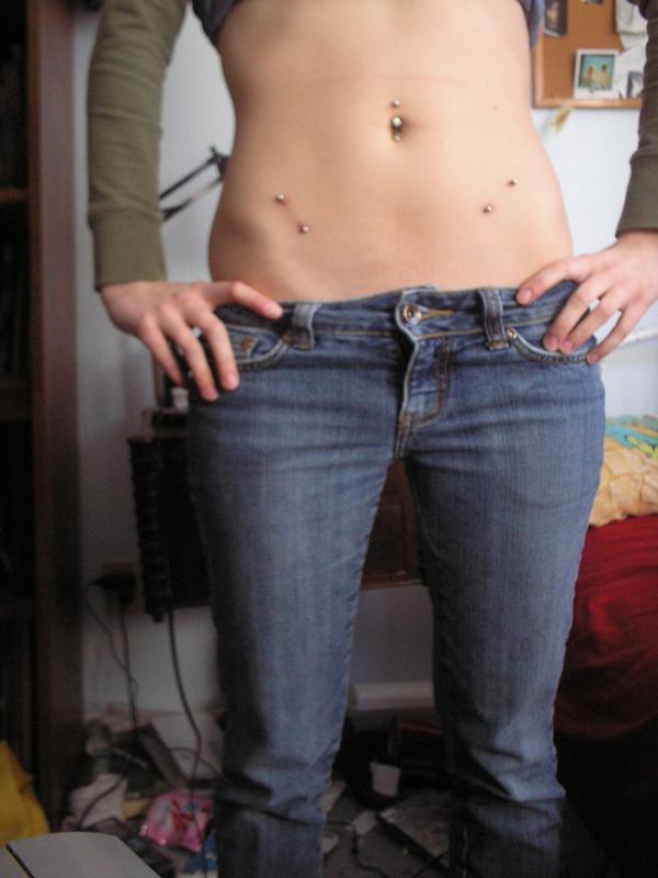 14 days after the piercing. This belly chain is attached to the belly bar