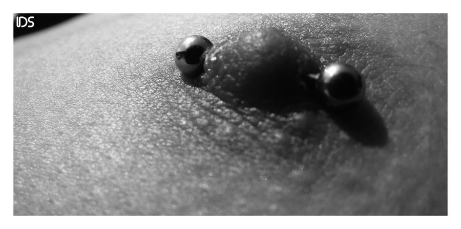nipple piercing photo. nipple piercing by