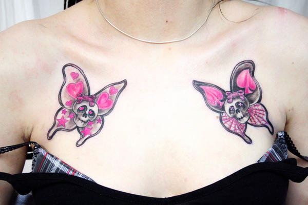 http://fc09.deviantart.net/fs23/i/2009/364/3/b/Butterfly_Skull_Girly_Tattoo_by_2Face_Tattoo.jpg