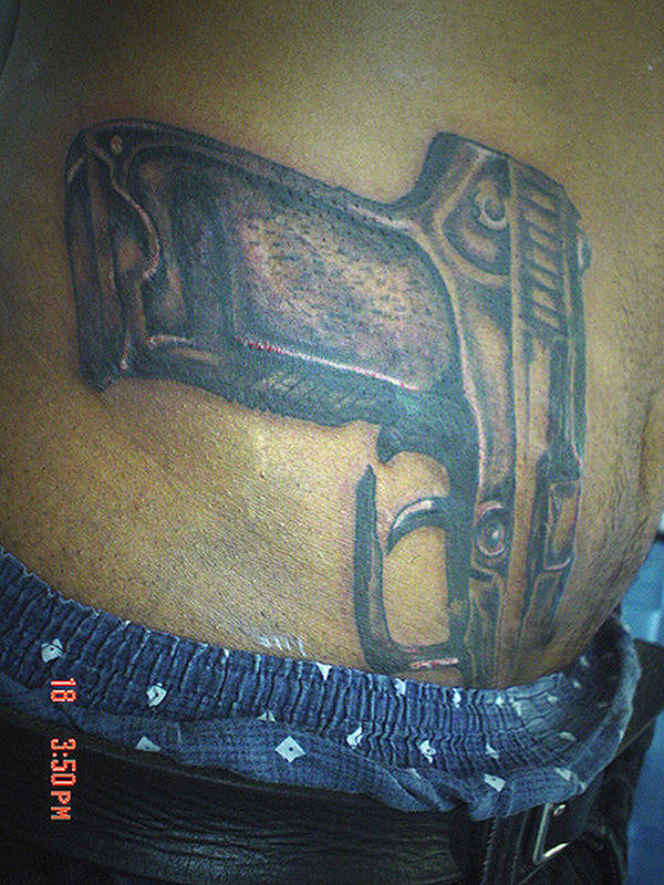 pistol tattoos. Glock 9mm pistol tattoo by