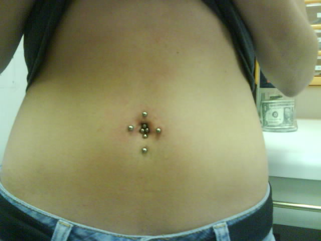 rejected belly piercing. that has a said top of Top