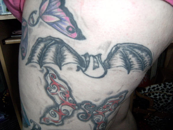 bat wing tattoos. at tattoos. M.. at wings