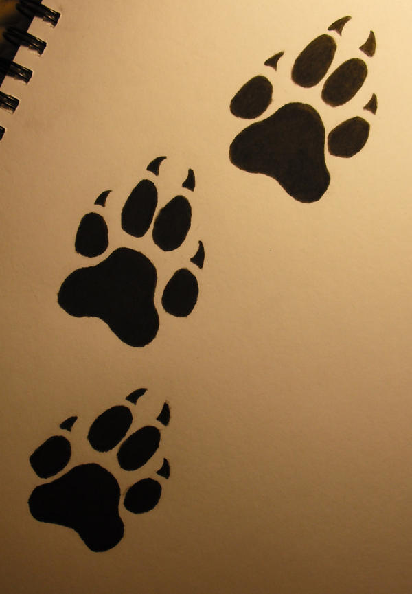 Wolf paw print tattoo by