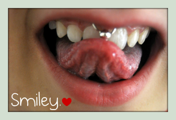 what is smiley piercing. a smiley piercing.