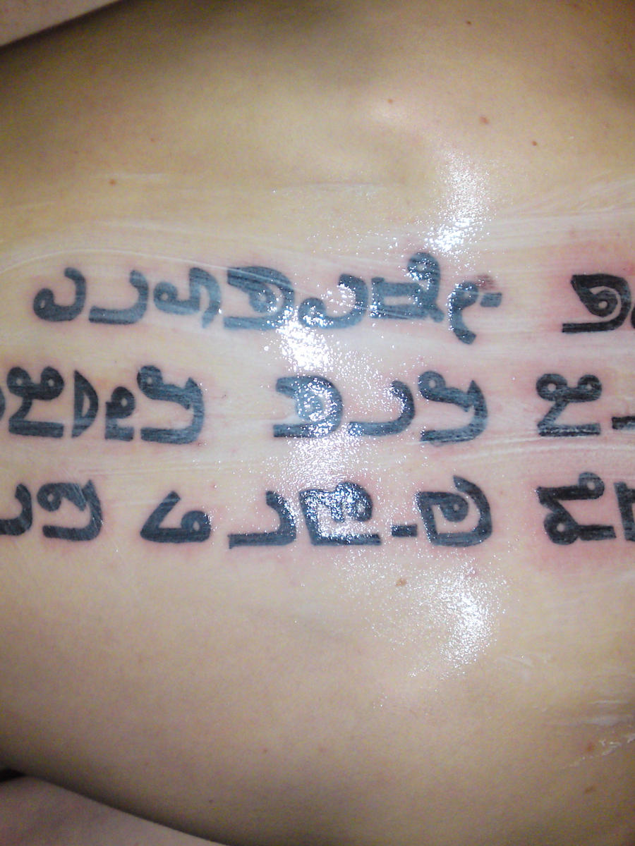 Thai script Tattoo by